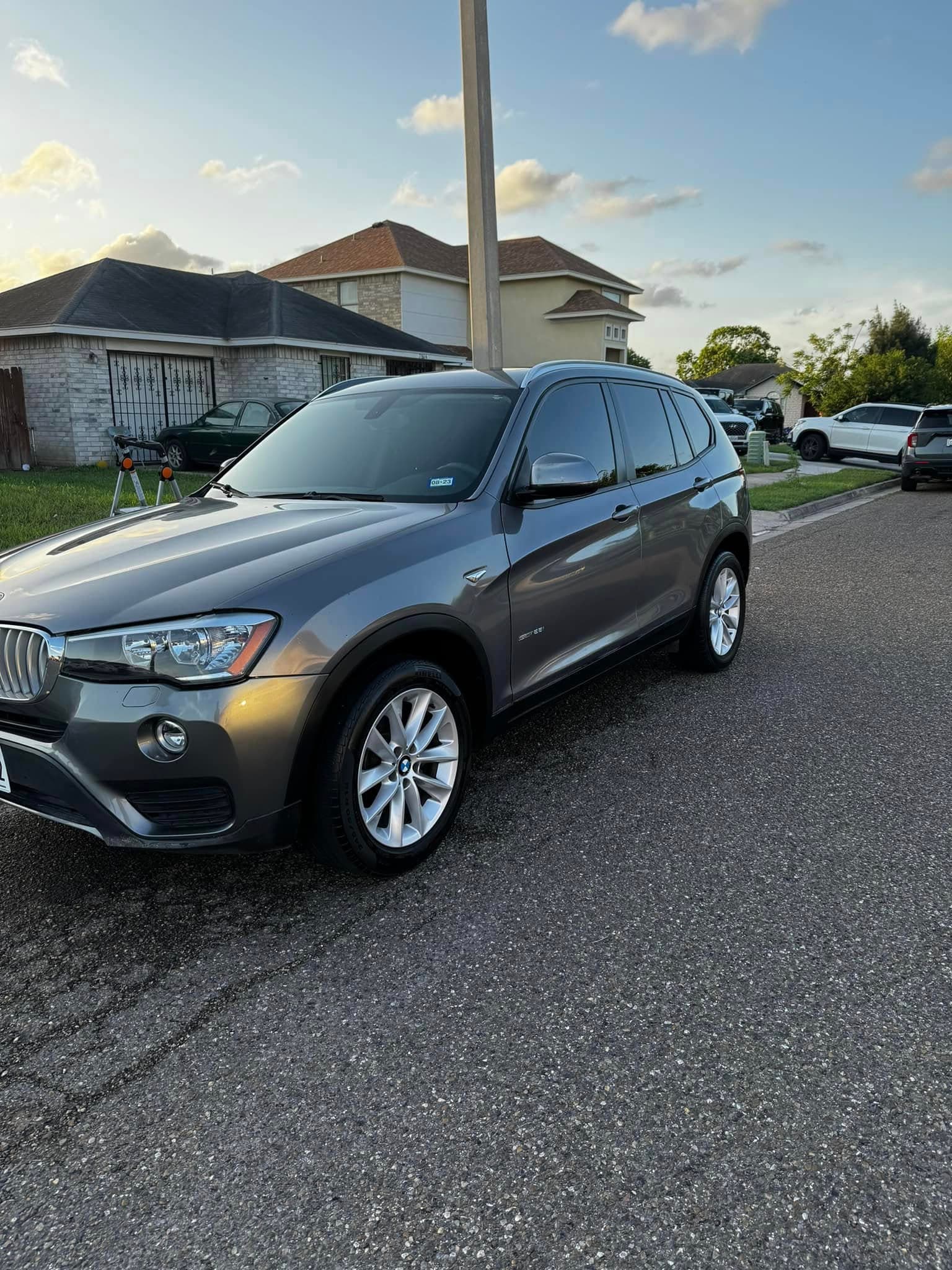 Space-grey BMW X3 detailed at golden hour